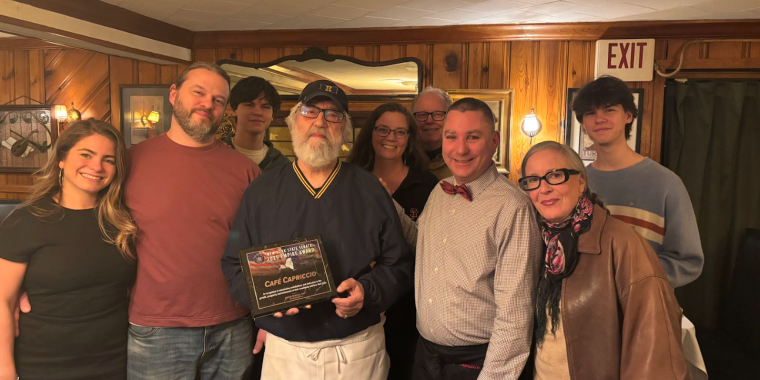 Owner Jim Rua, son Franco Rua, Caitlin, and staff at Cafe Capriccio.