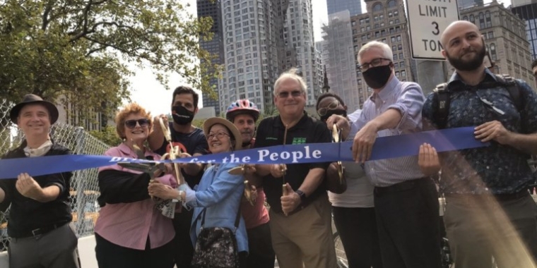 This ribbon-cutting ceremony at the Manhattan end of the Brooklyn Bridge opened the bridge’s long-awaited, two-way bike lane. Among those seen here are DOT Commissioner Hank Gutman (in sunglasses, toward center) Brooklyn Assemblymember Jo Anne Simon (second from left); Manhattan Councilmember Margaret Chin (next to her, holding up scissors); Brooklyn-Manhattan State Sen. Brian Kavanagh (second from right) and Brooklyn Councilmember Steve Levin. Photo courtesy of NYC DOT
